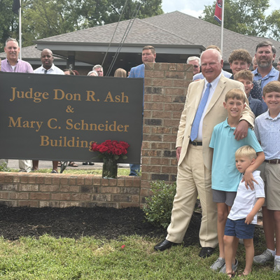 Judge Don R. Ash in front of the newly dedicated Recovery Court sign