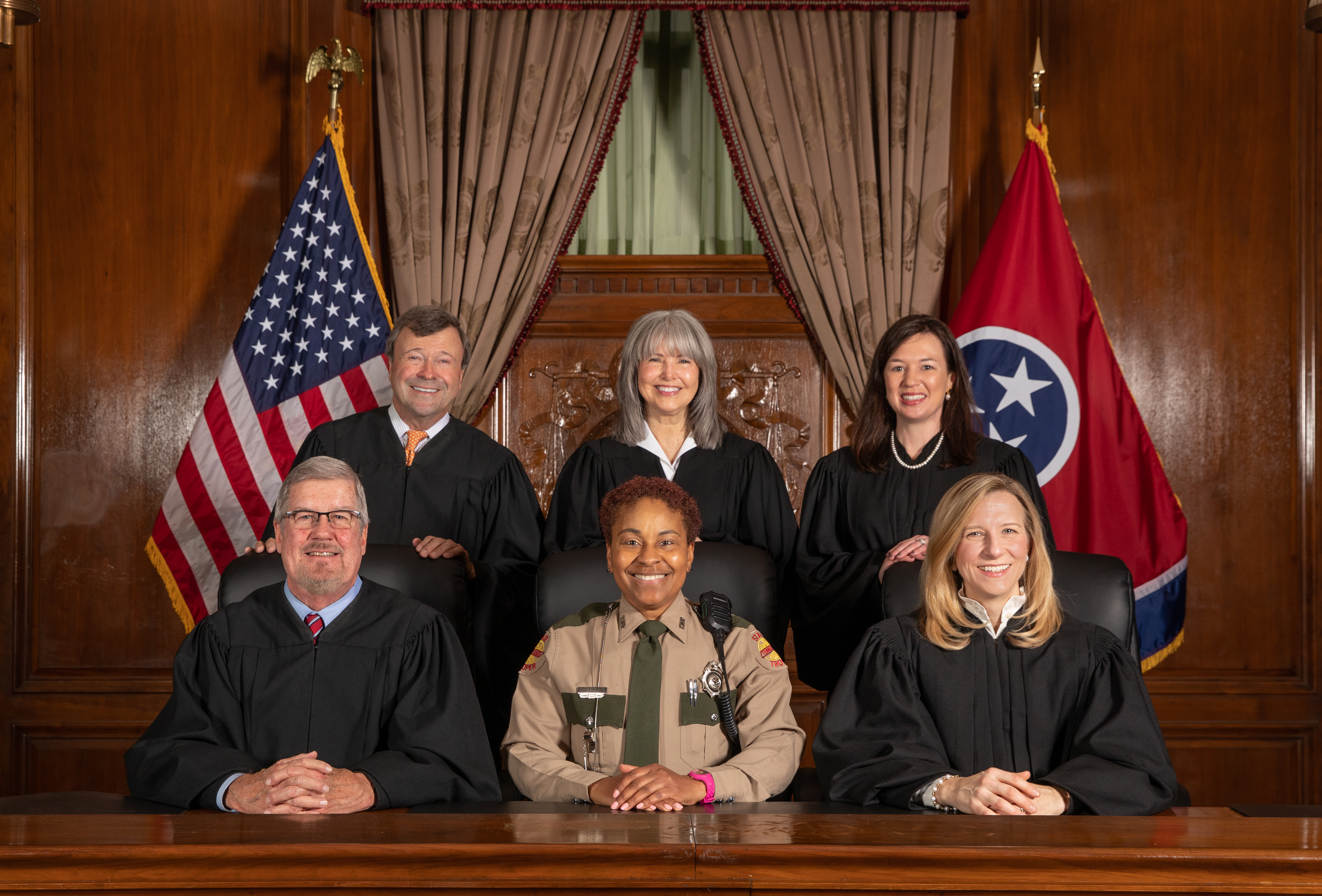 Trooper Tara Lee with the justices of the Tennessee Supreme Court, (left to right): Justice Jeffrey S. Bivins, Justice Dwight E. Tarwater, Chief Justice Holly Kirby, Justice Mary L. Wagner and Justice Sarah K. Campbell
