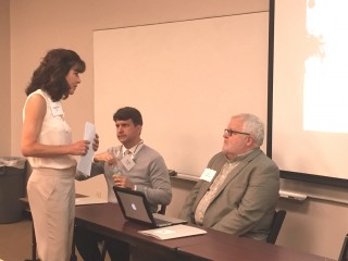 Larry Bridgesmith speaks with attendee with Joseph Fanning alongside.