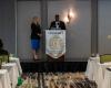 Judge Thompson speaking at the conference with Judge Bowling looking on